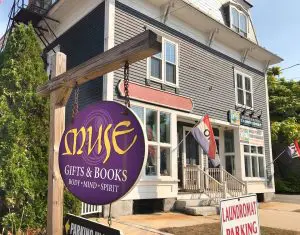 outside of muse building with purple sign in forefront