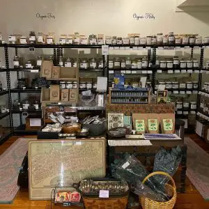 tea and spice racks inside of shadow emporium