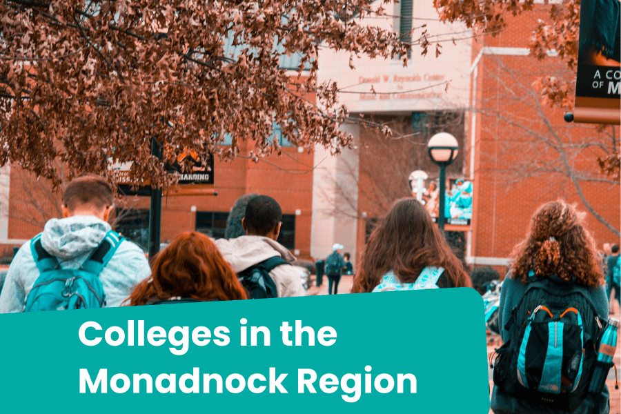 Four students with backpacks head to a university building