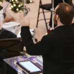 closeup of conductor leading orchestra