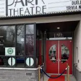 red carpet entrance to park theatre with old fashioned movie theatre signage